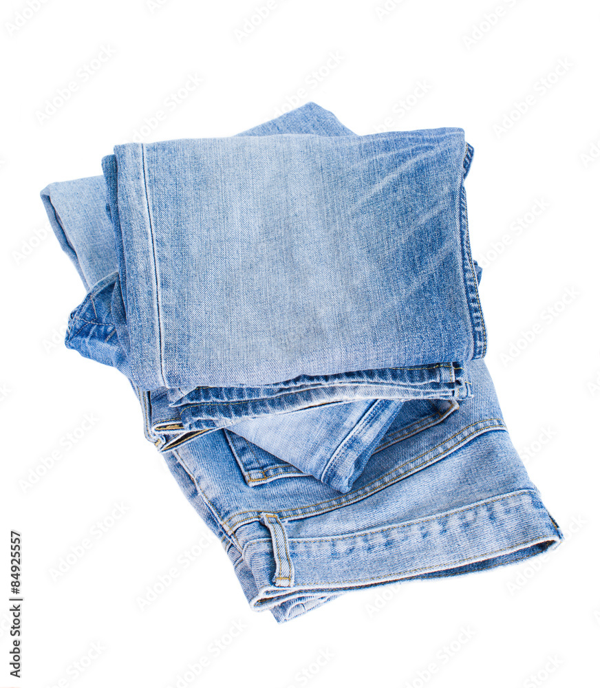 Stack of blue denim jean isolated on white background