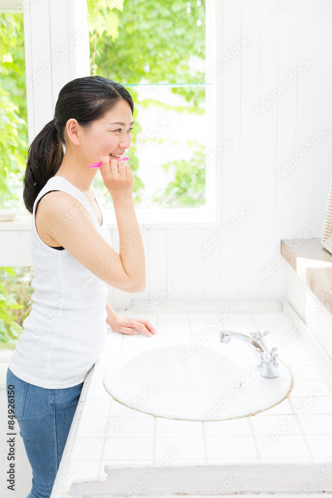 young asian woman in bathroom