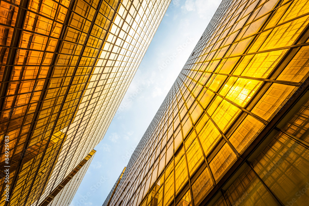 low angle view of modern skyscraper exterior and sky