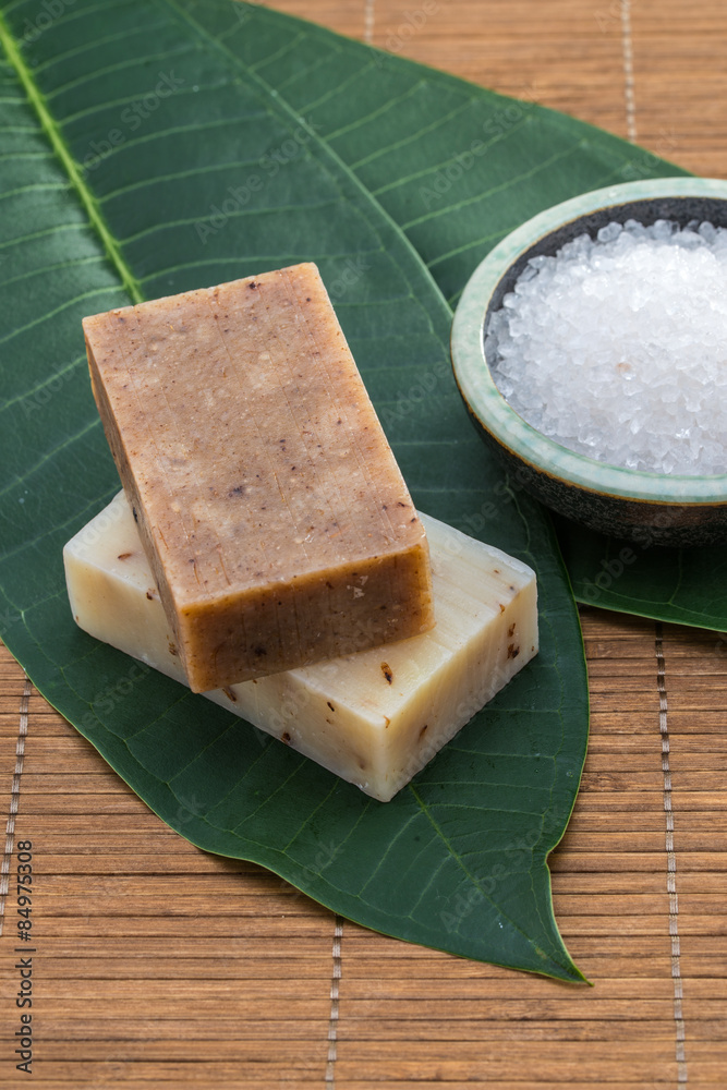 soap, salt bowl china , on green leaves for health spa