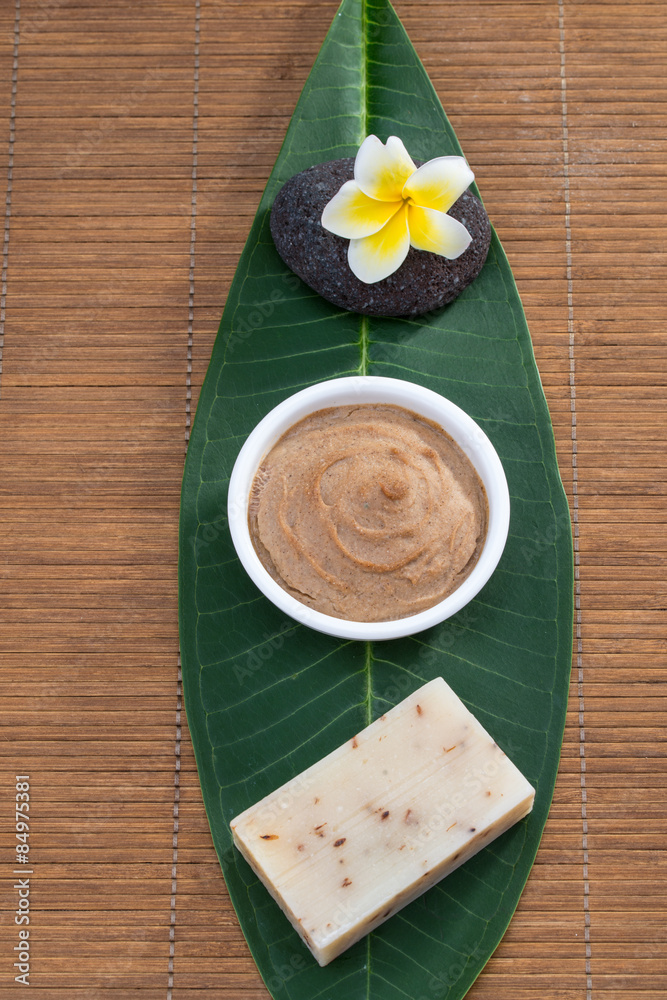 above veiw, soap flower Facial mask on green leaf