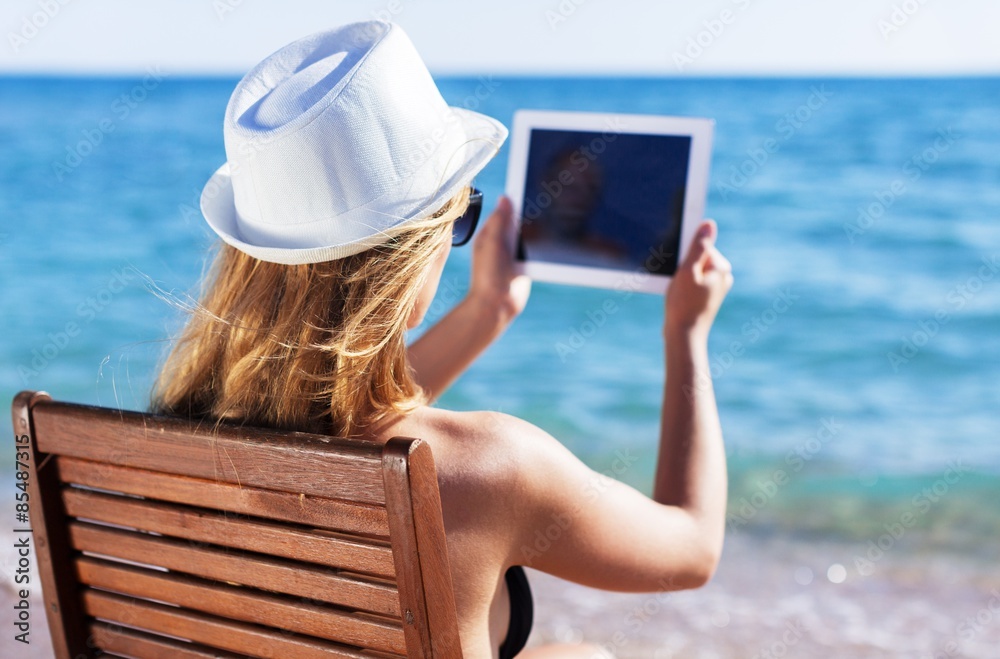 Tablet, beach, chair.