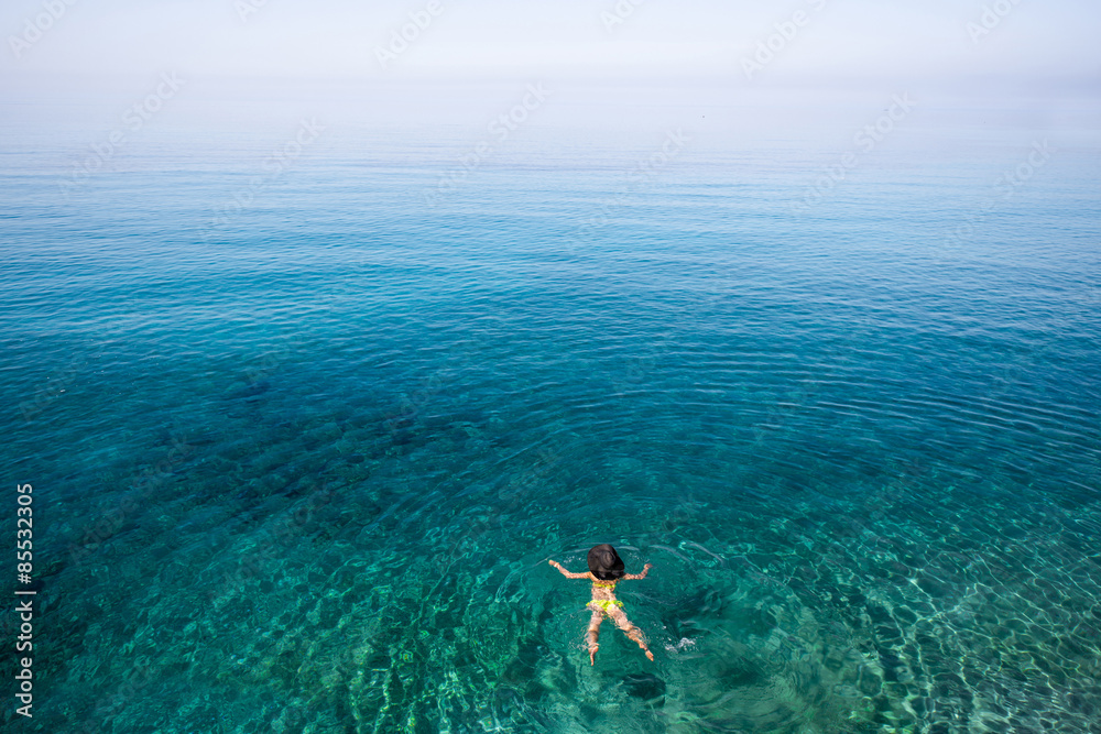 Woman swimming in the sea