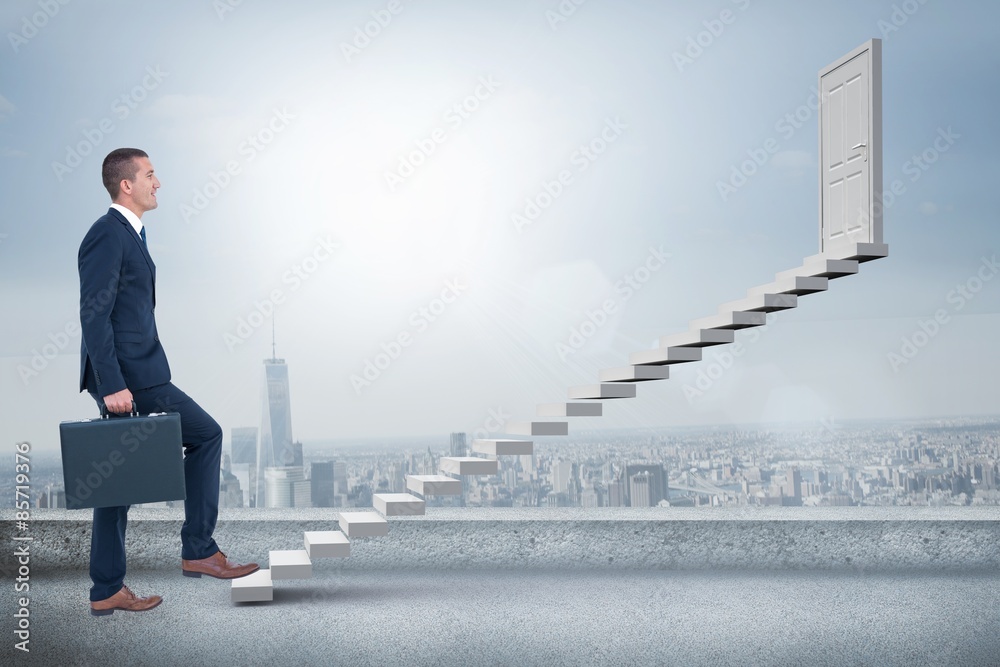 Composite image of businessman climbing with briefcase