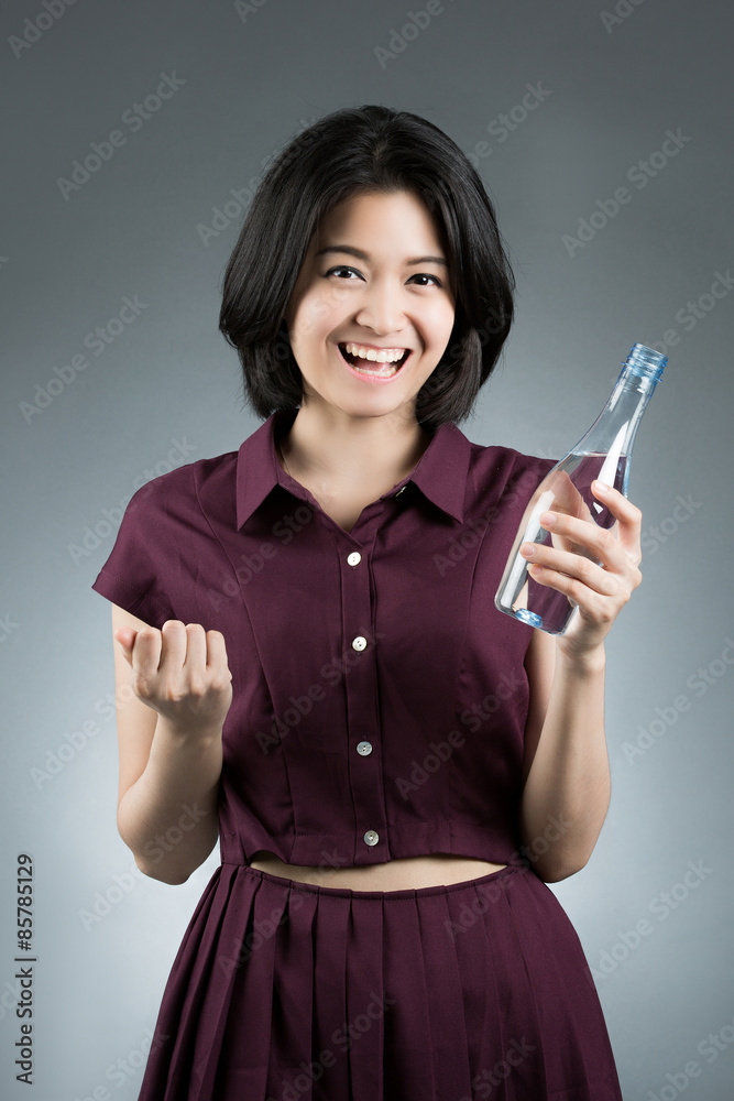 Women so happy and she was holding a bottle of drinking water. T