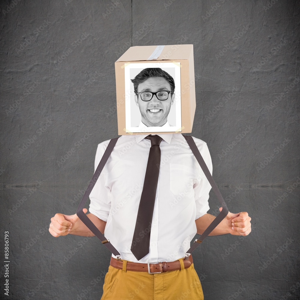 Composite image of businessman with photo box on head