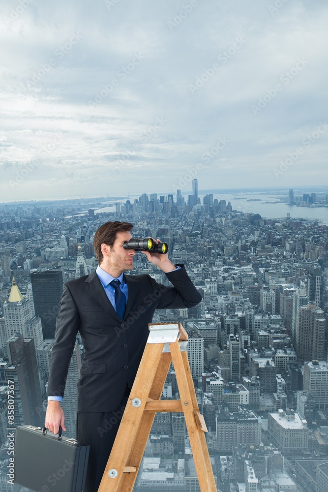 Composite image of businessman looking on a ladder