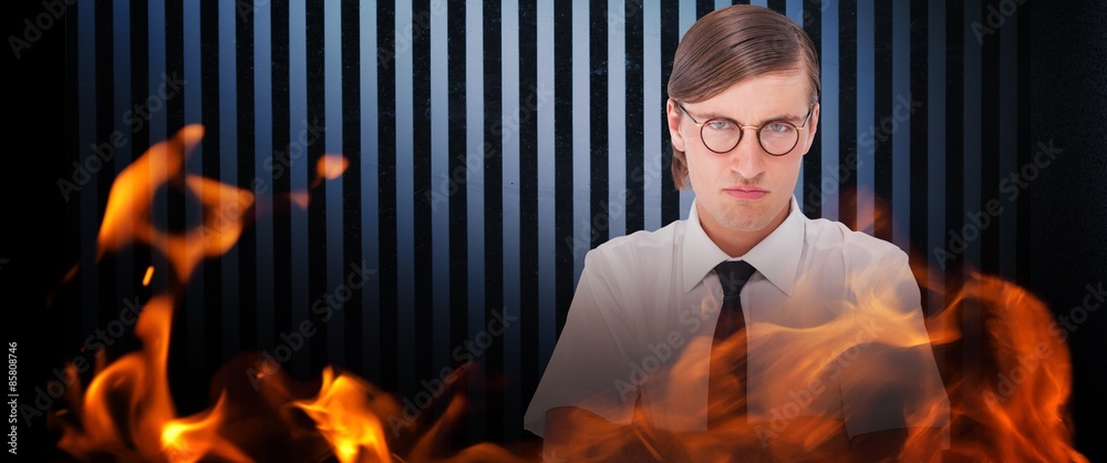 Geeky businessman looking at camera with arms crossed