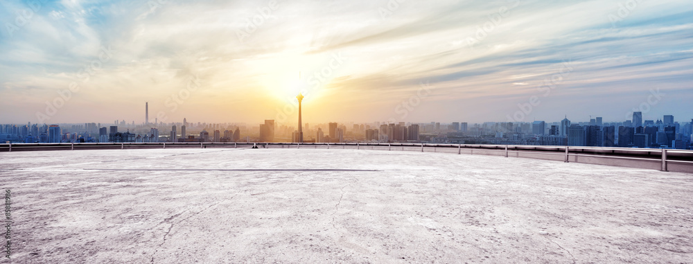 Panoramic skyline and buildings with empty concrete square floor