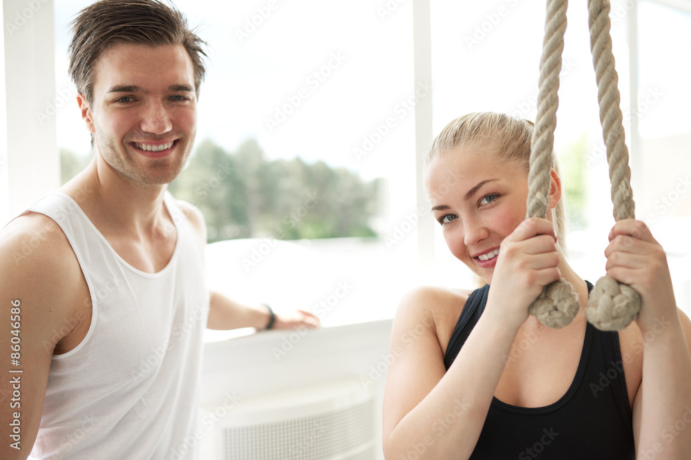 Woman with her Personal Trainer Smiling at Camera