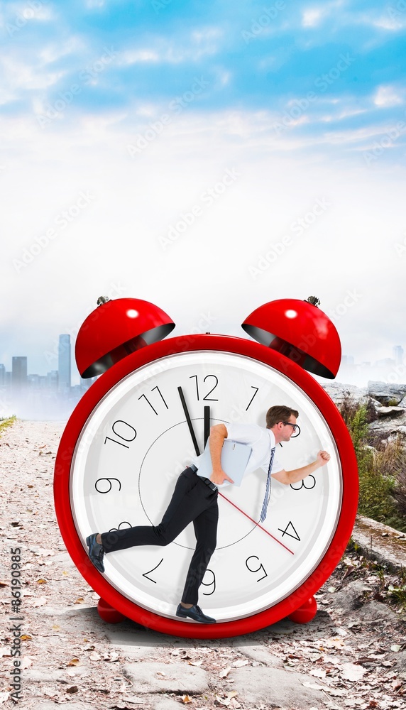 Composite image of geeky businessman running late