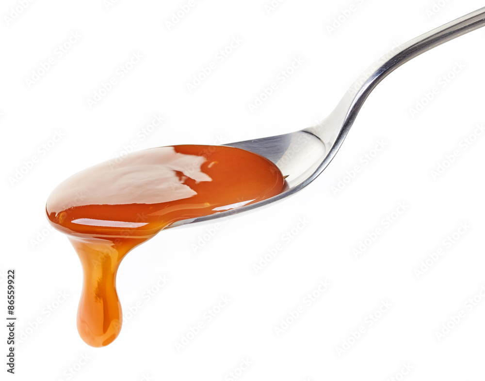 spoon of caramel sauce