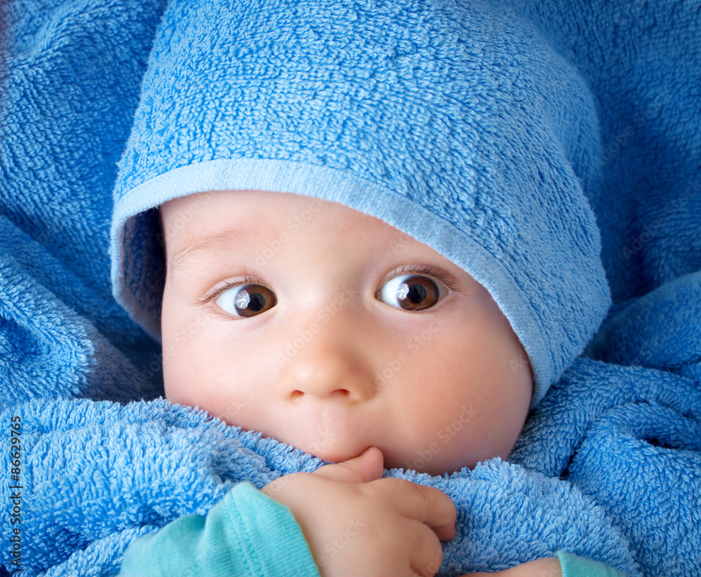 Cute baby in a towel