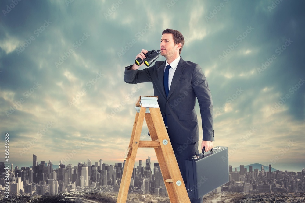 Composite image of businessman looking on a ladder