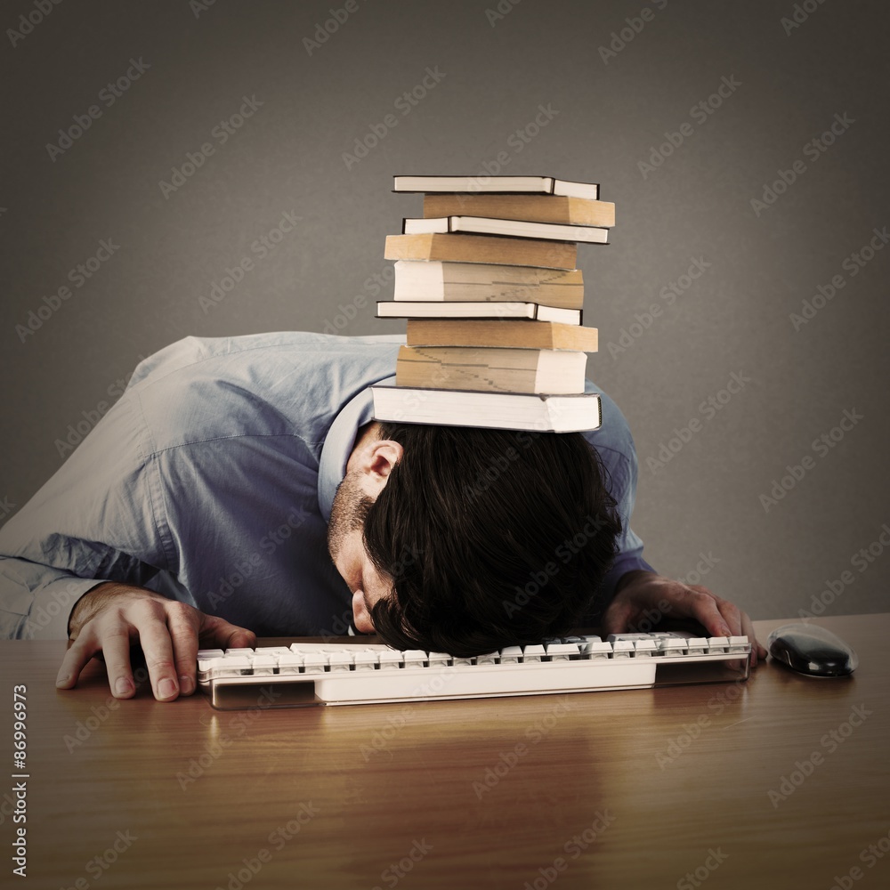 Composite image of businessman sleeping on his keyboard