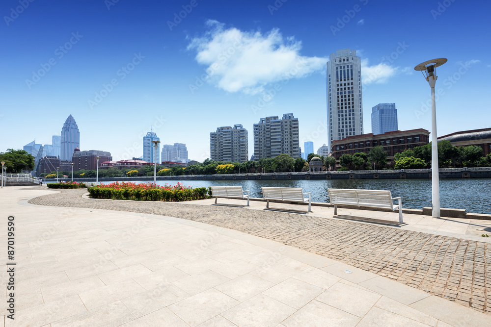 Modern skyline and empty road floor