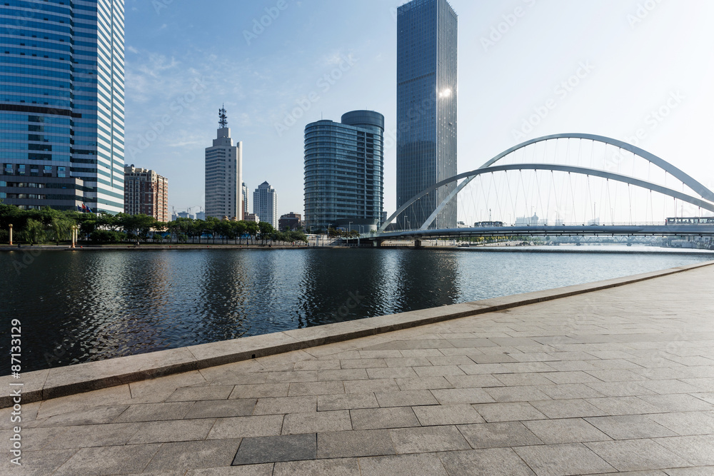 Modern skyline and empty road floor