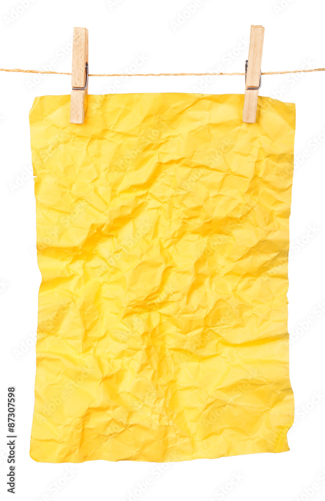 yellow paper-a poster on clothespins