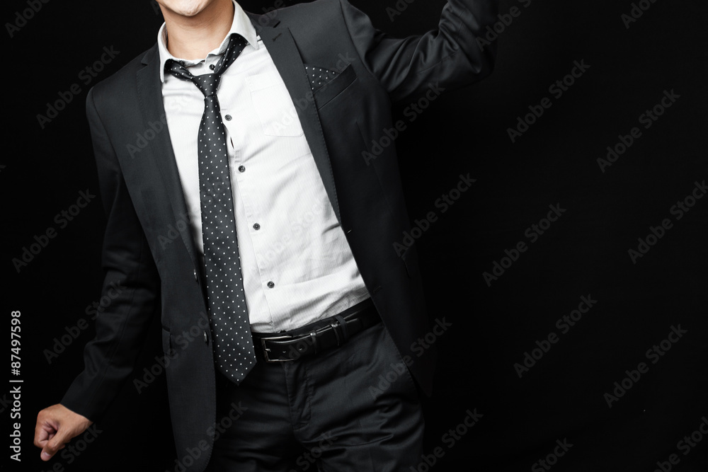 man in suit on a black background