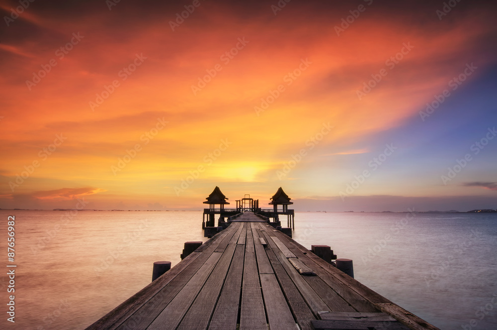 Landscape of Wooded bridge in the port between sunrise