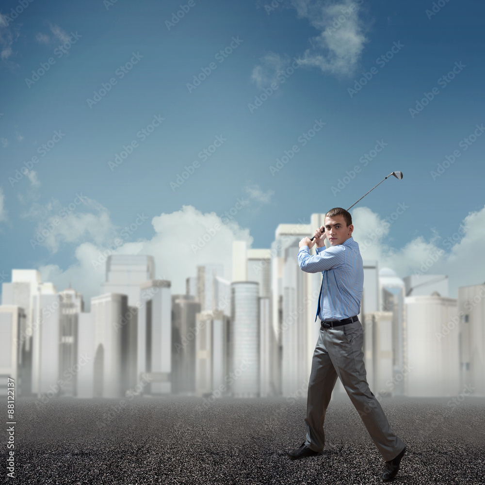 Businessman playing golf