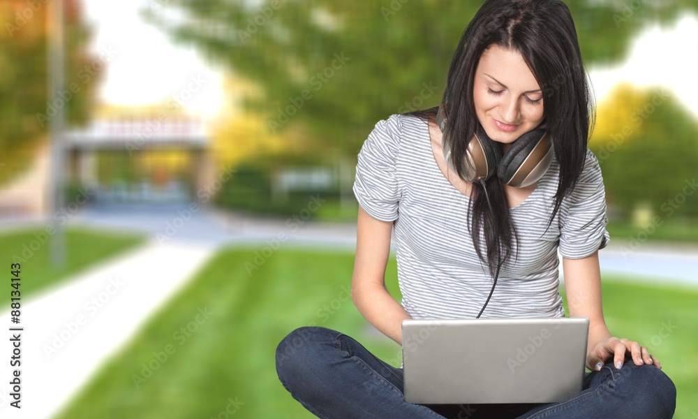 Student, laptop, park.