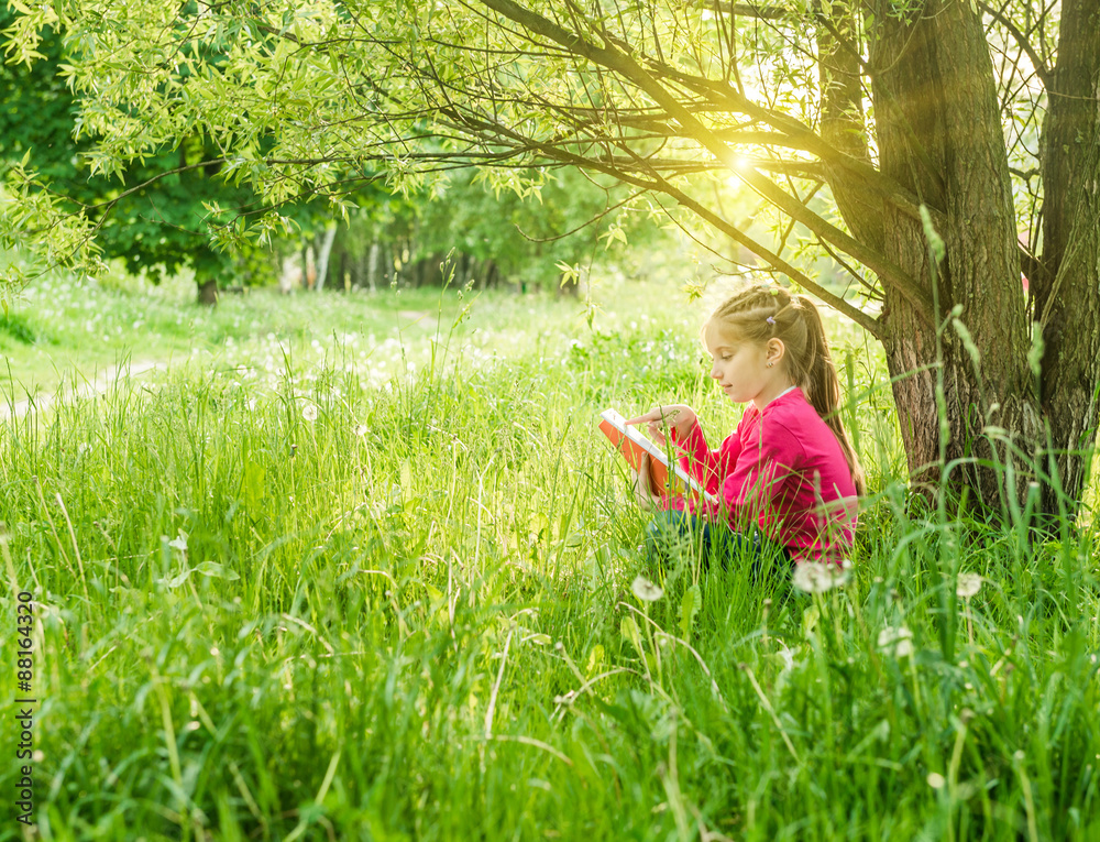 Cute little girl read the book