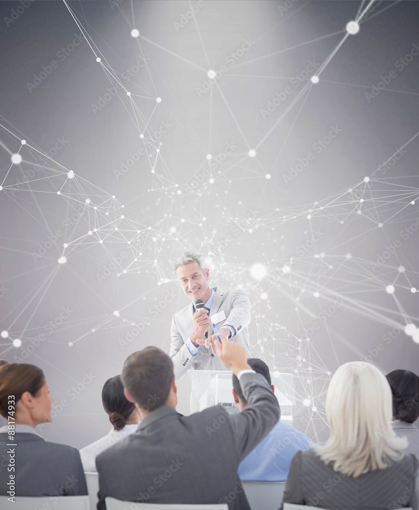 Composite image of businessman doing speech during meeting 