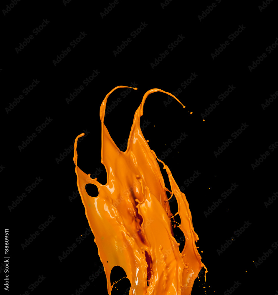 Orange paint splash on black background