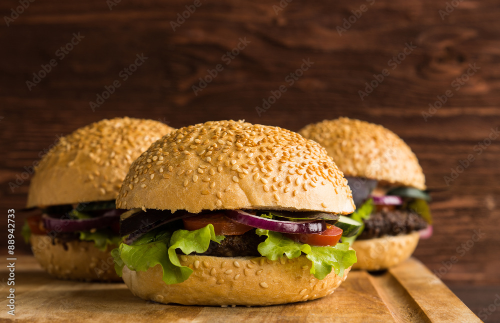 Burgers on the wooden background