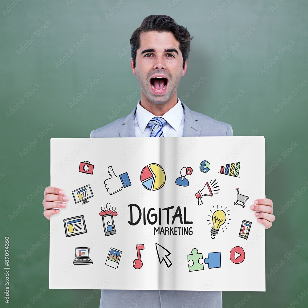 Composite image of businessman showing a book