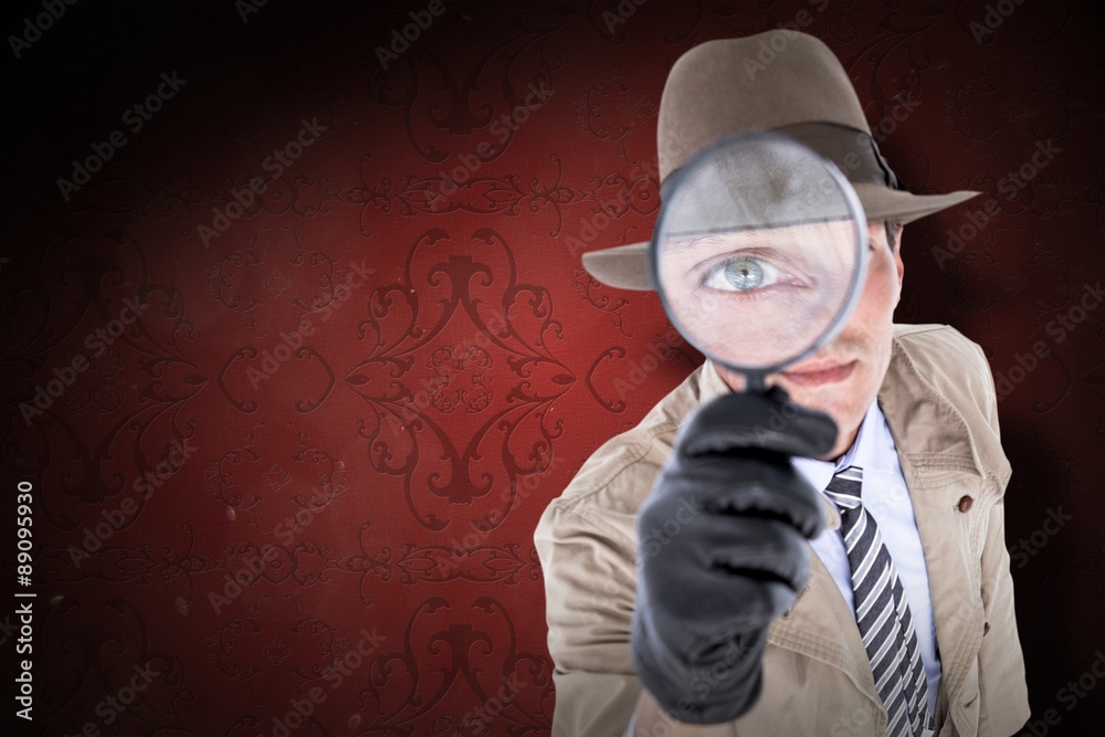 Composite image of spy looking through magnifier