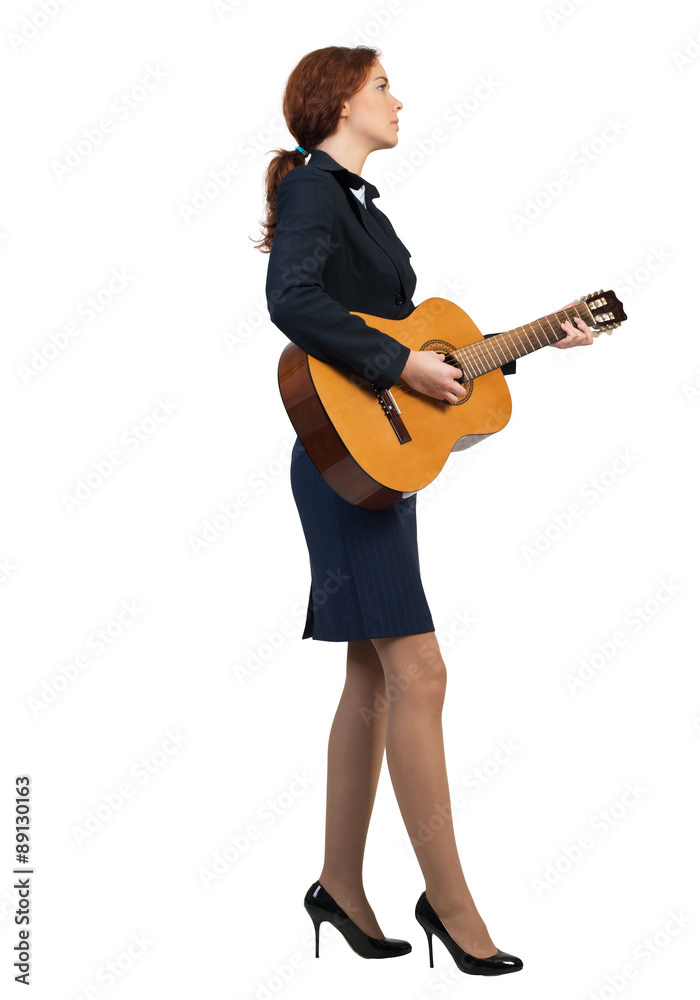 Businesswoman with guitar