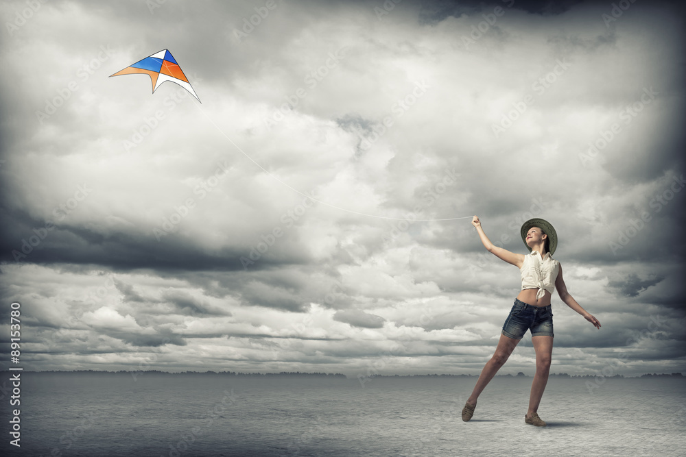 Girl and flying kite