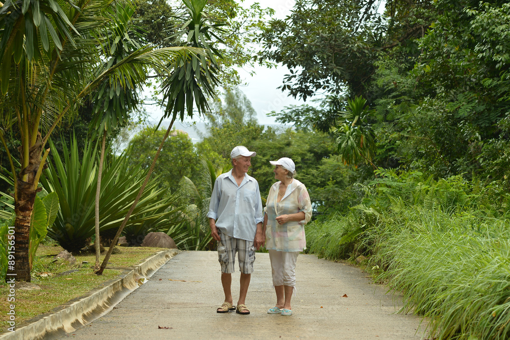 Elderly couple  in tropical garden