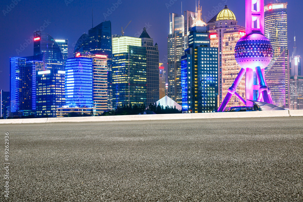 Asphalt road in front of the modern city Shanghai ，china