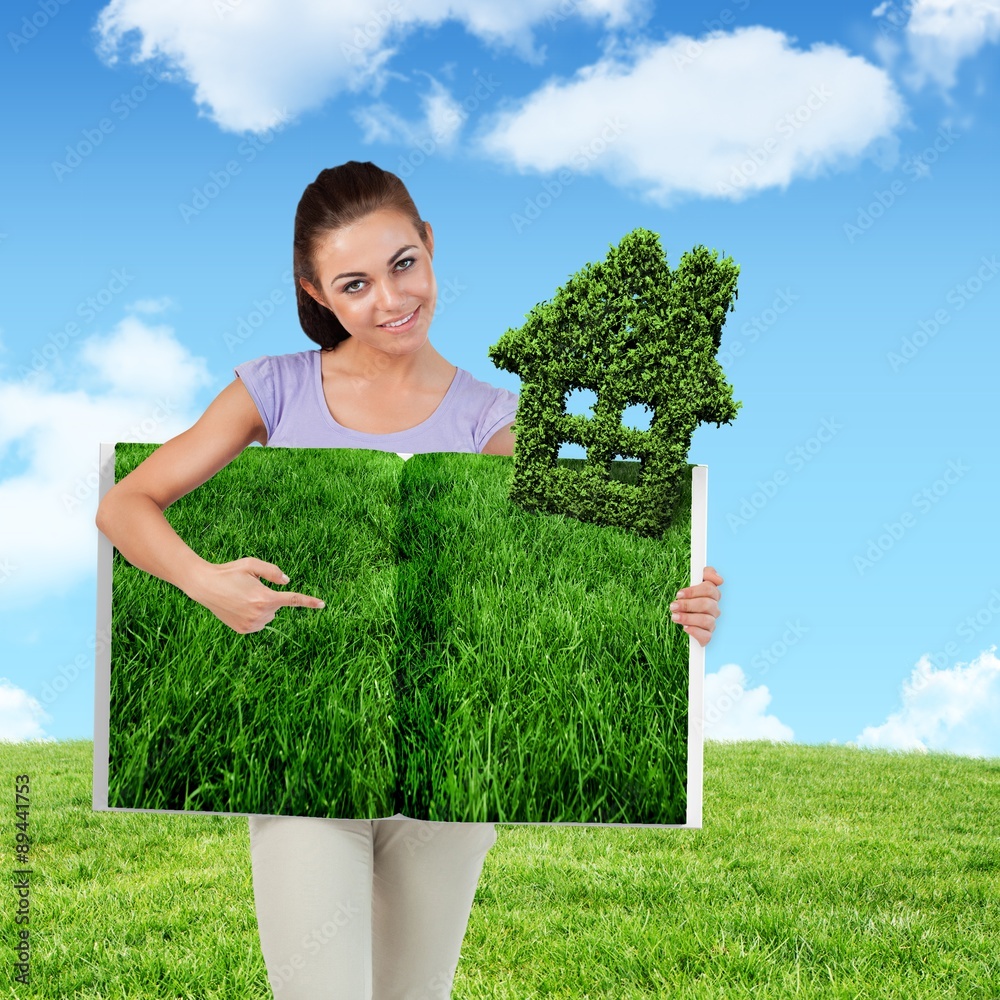 Composite image of woman pointing lawn book