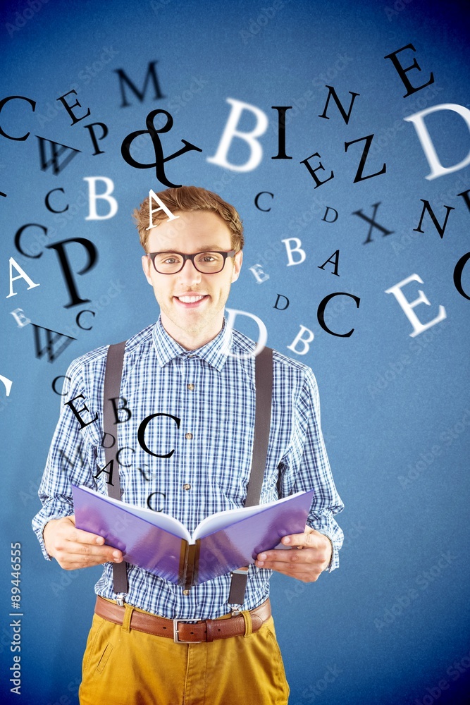 Composite image of geeky student reading a book