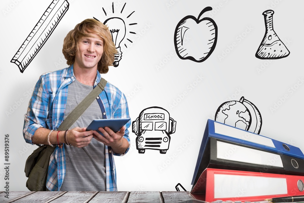 Composite image of student using tablet in library 