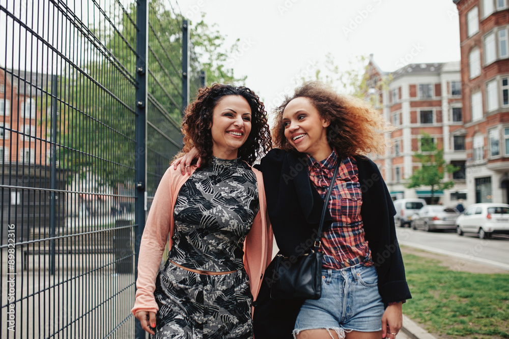 Two young women on the city street