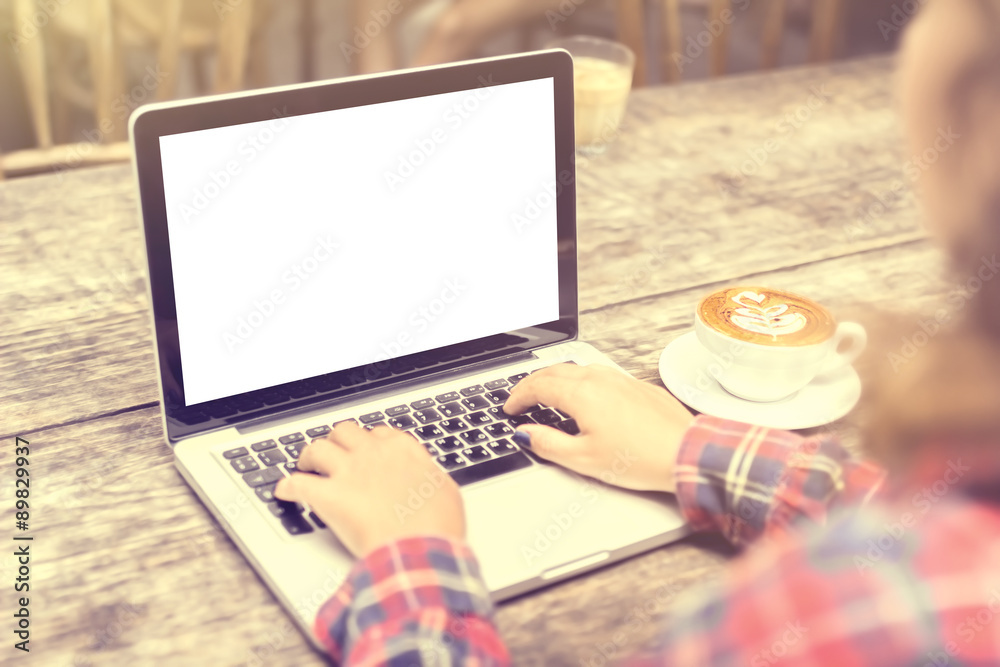 girl with a cup of coffee and a blank laptop, mock up