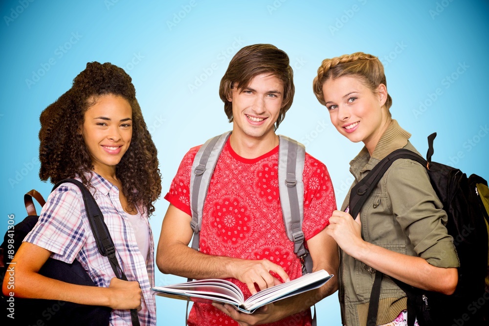 Composite image of college students reading book in library