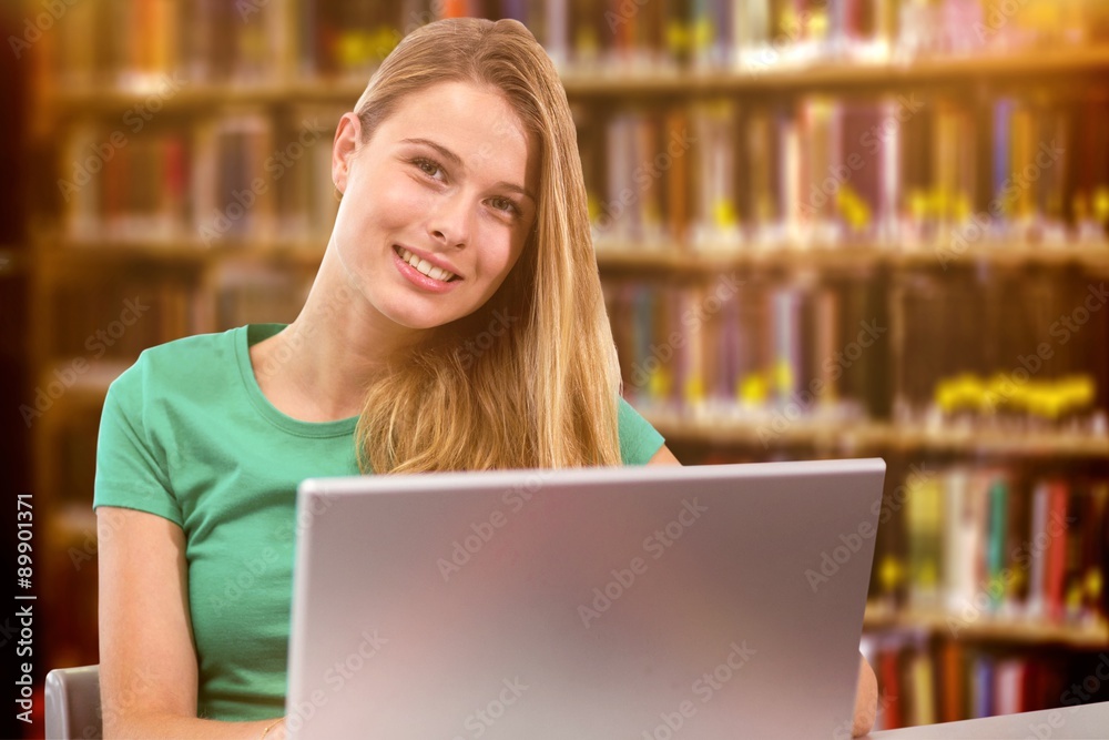 Composite image of student on laptop