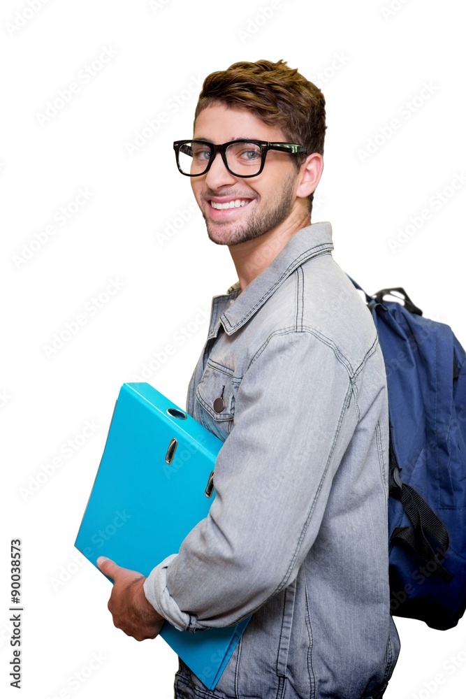 Composite image of student smiling at camera in library