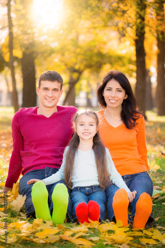 Happy family in autumn park