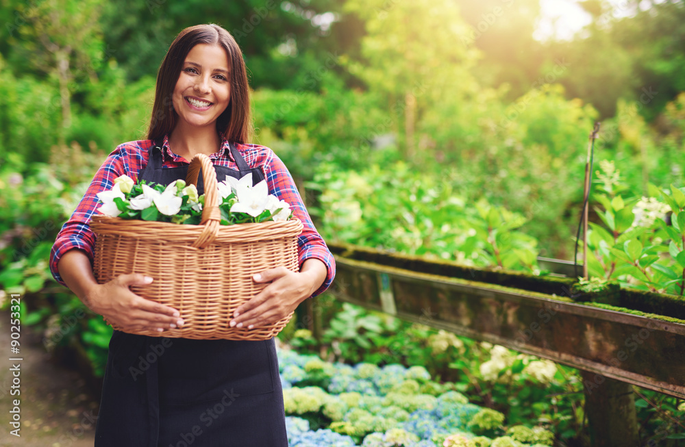 Young florist working in the greenhouse