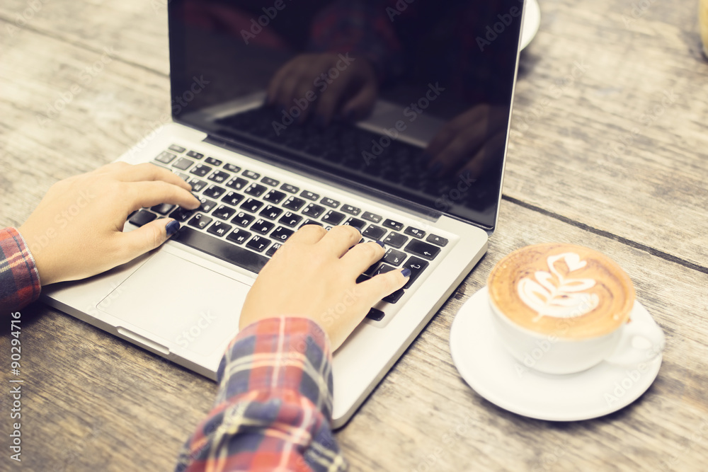 Girls hands, cappucino and laptop outdoor