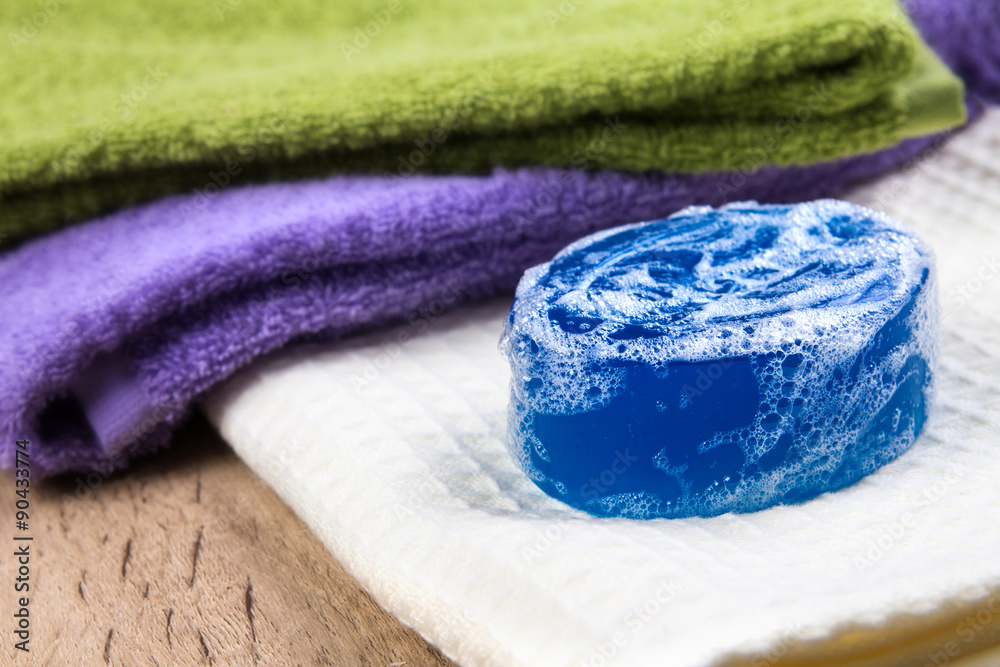 selective focus of natural soap bar and bubble with bath towel o