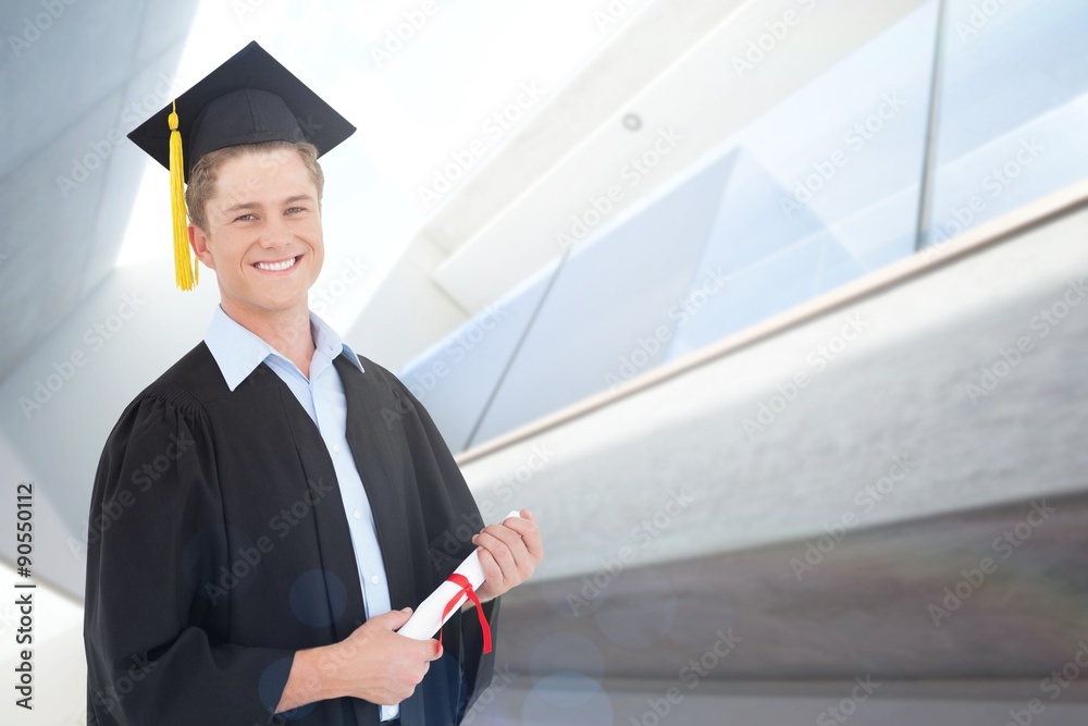 Smiling man with a degree in hand 