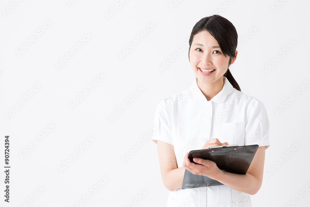 young asian nurse on white background